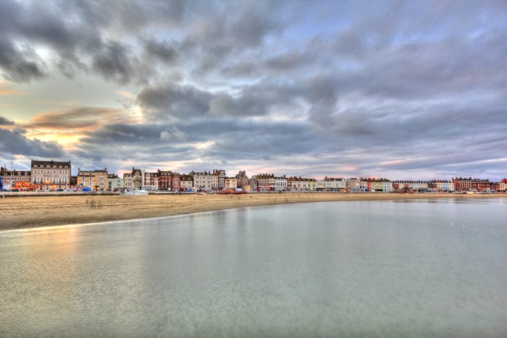 Weymouth Beach at sunset in the concept of parks and green spaces in Weymouth.