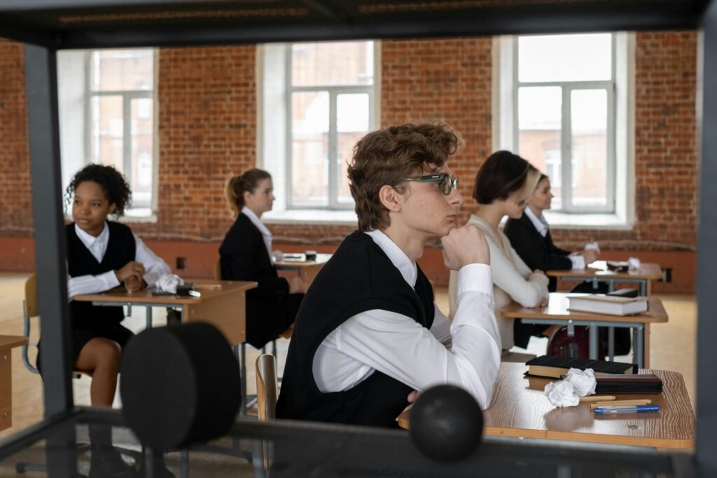 Side view of the students inside the classroom in the concept of 'top schools in Weymouth'.