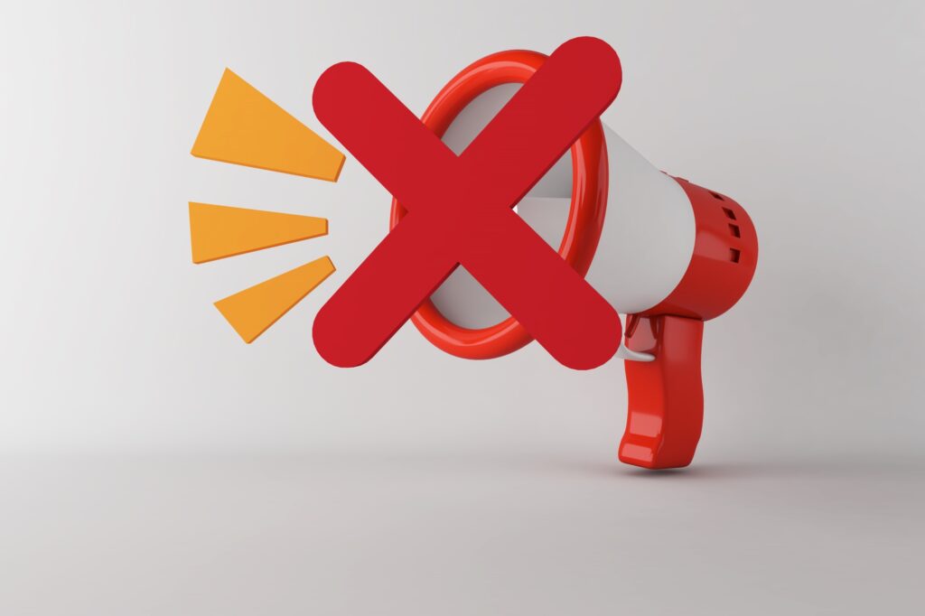 A 3D-megaphone with an 'X' to symbolise 'Not To Do'