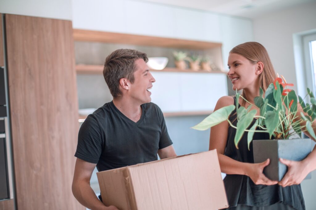 A happy young couple just arrived at their new house